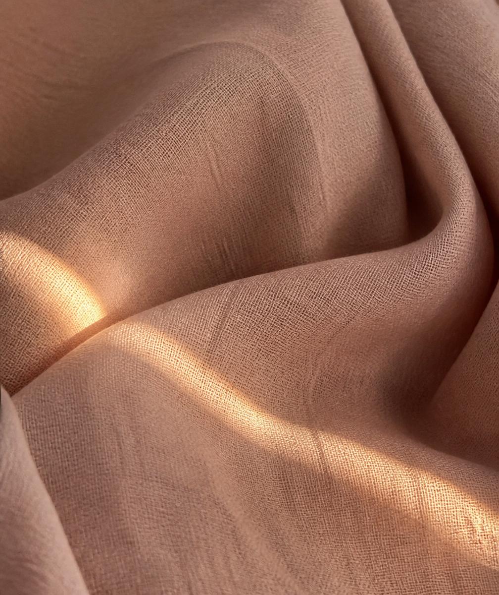 Folded linen catching soft afternoon light
